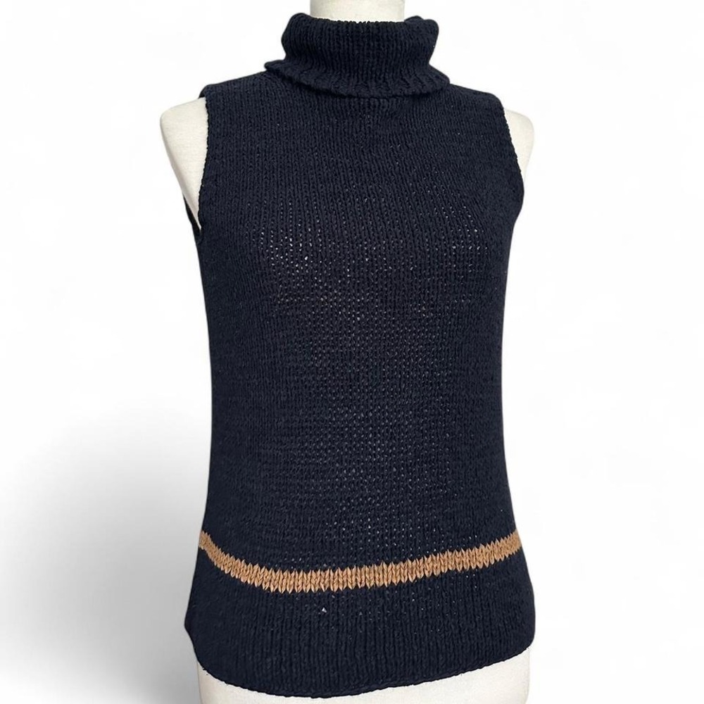 Sleeveless eyelet knit turtleneck by Norton McNaughton